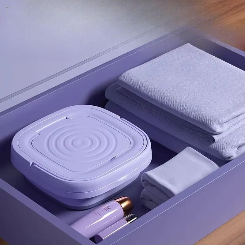 Space-saving travel washer unfolding for a small apartment