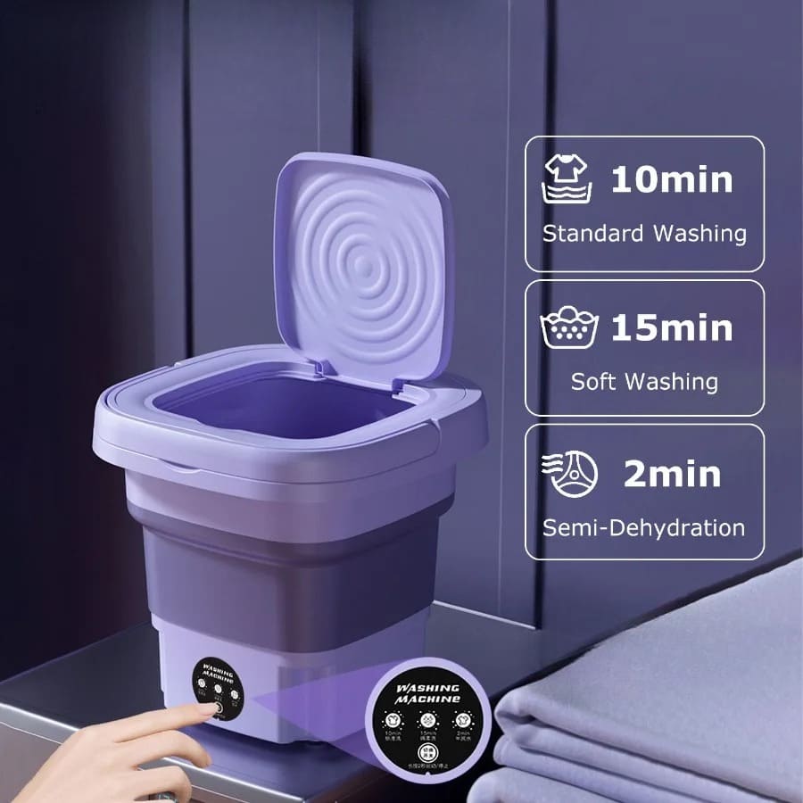 Travel-ready portable laundry machine beside an RV