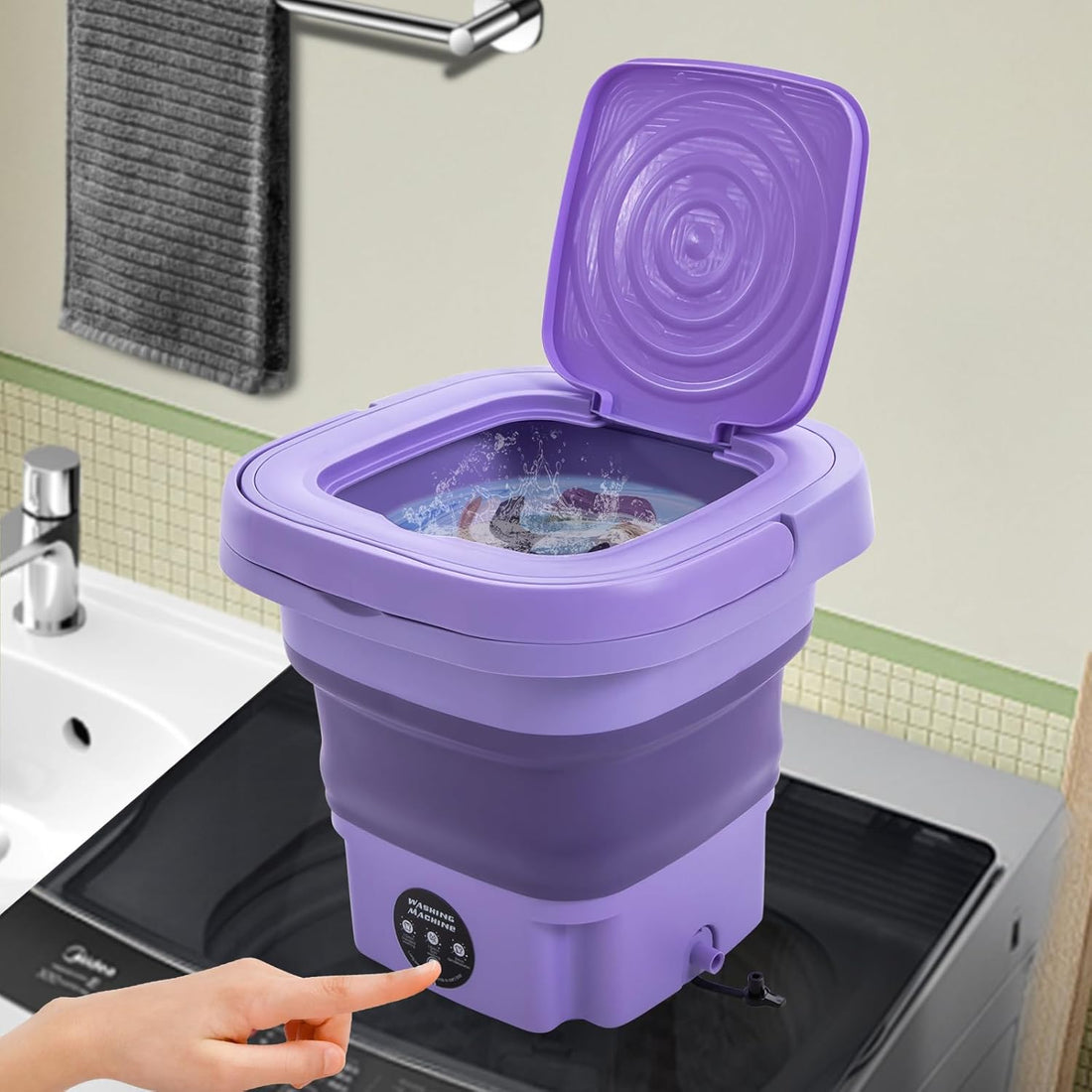 Compact washer cleaning baby clothes in dorm room